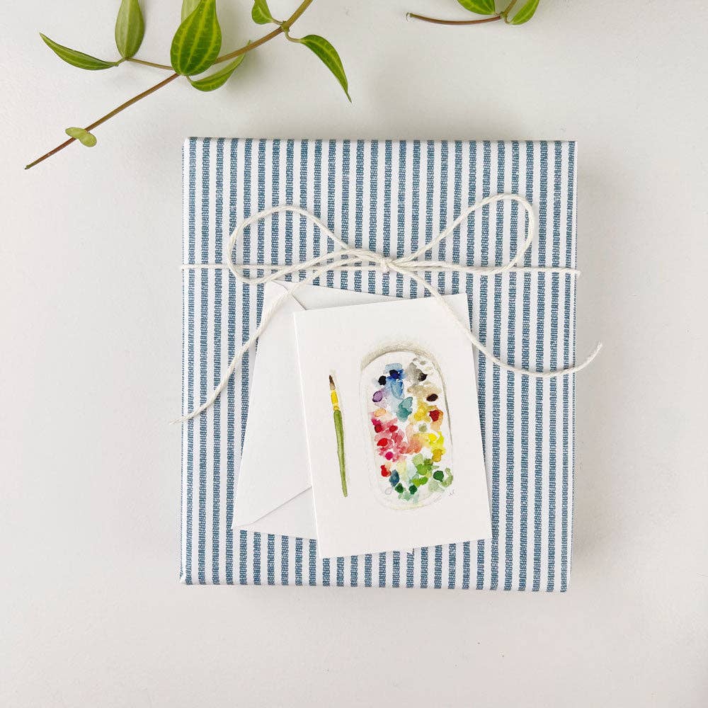 Creative mini enclosure card attached to a wrapped gift.