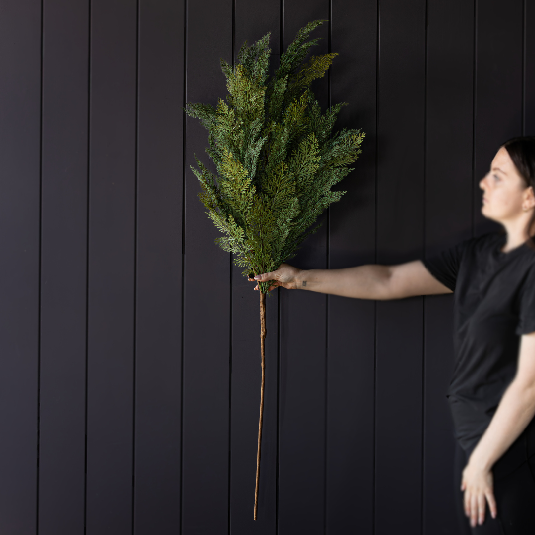 Large 42-inch Cypress Leaf Real Touch Stem by Luxe B Co. featuring 12 full sprigs of realistic evergreen foliage.