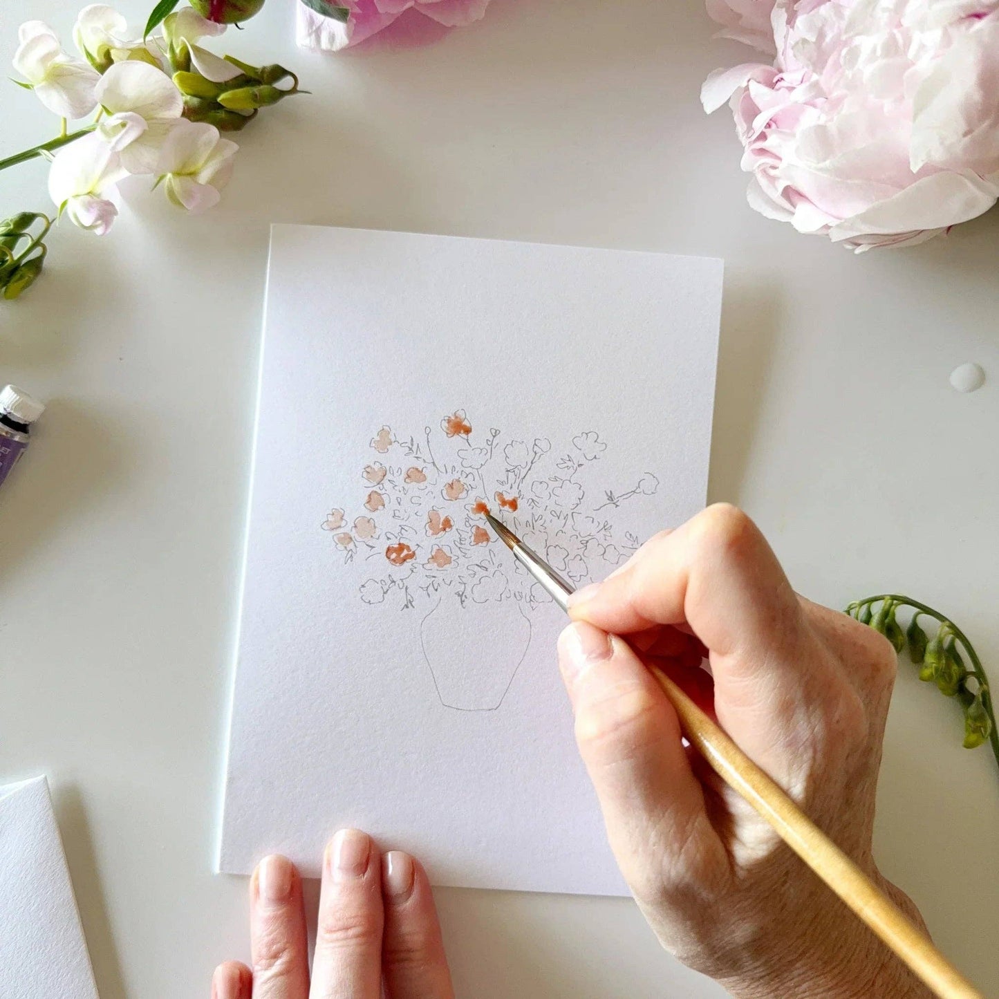 Bouquet paintable notecard set styled with watercolor supplies and botanical stationery.