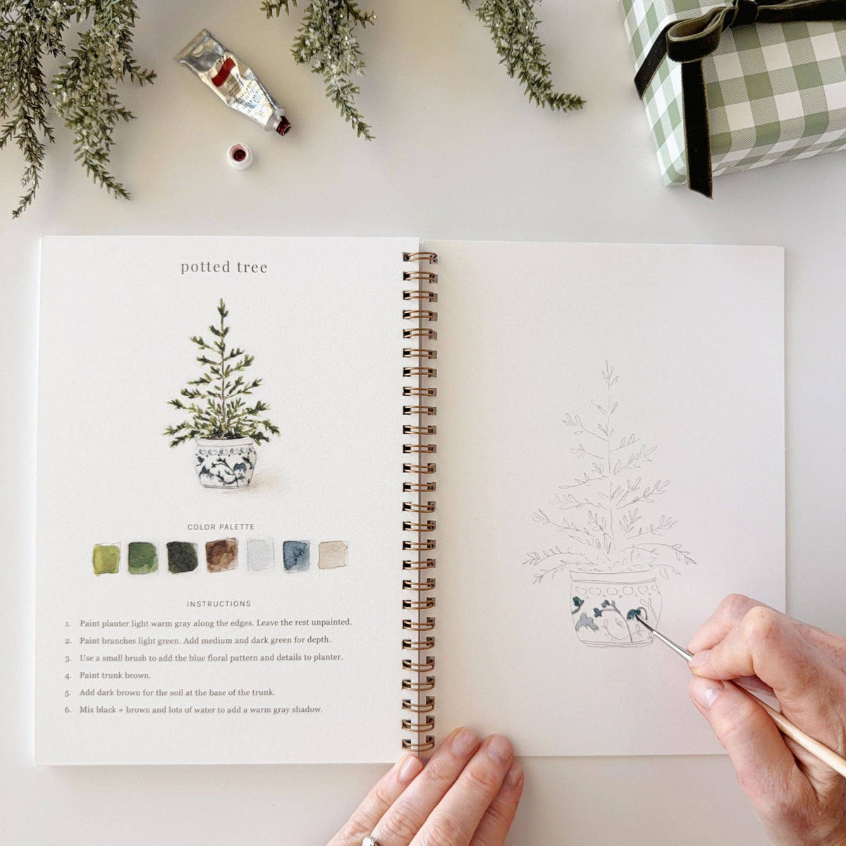 Classic Christmas Watercolor Workbook by Emily Lex featuring beginner-friendly holiday watercolor painting projects.
