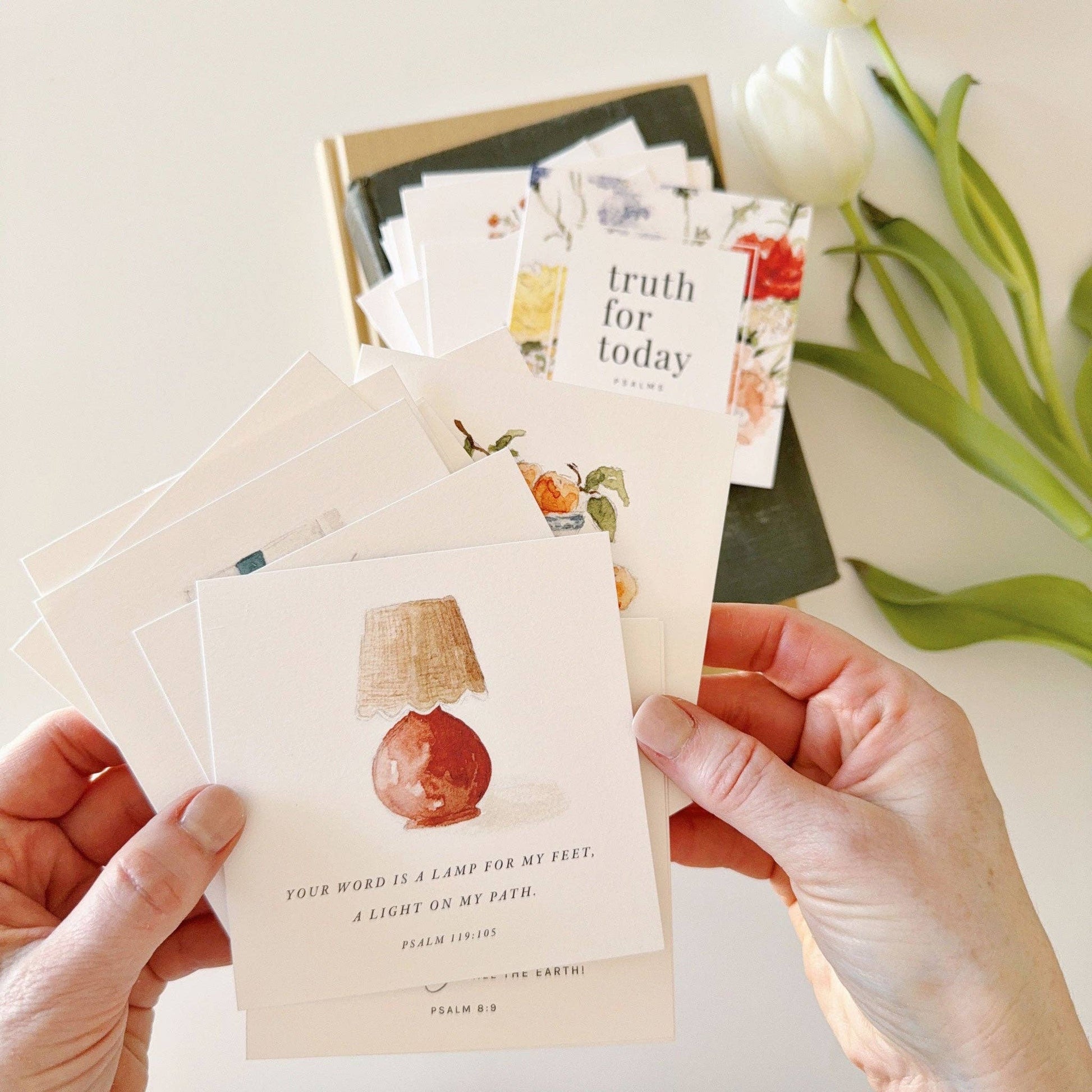 Close-up of watercolor Psalms Scripture cards printed on 120 lb cotton eggshell textured paper with encouraging Bible verses.