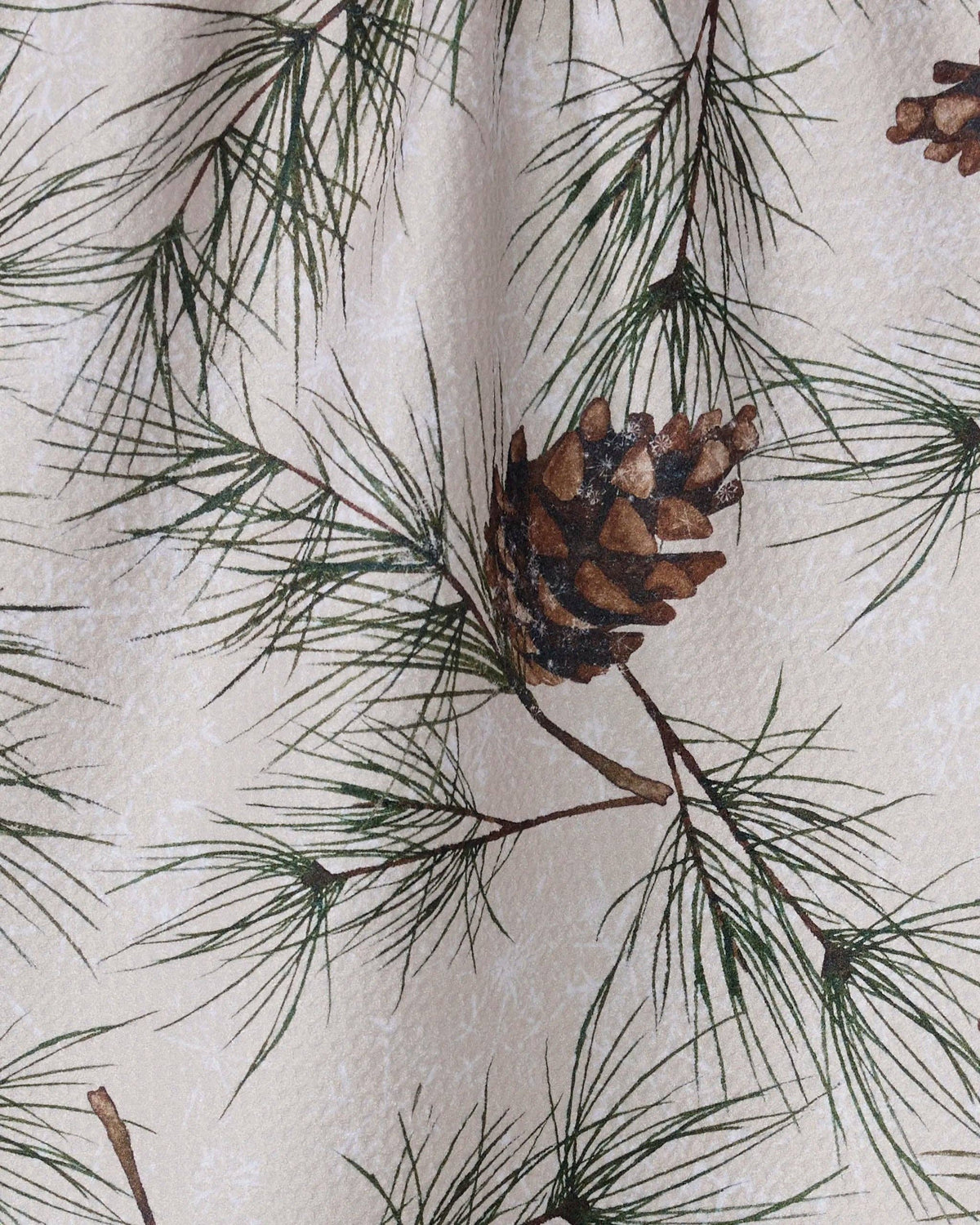 Close-up of the Evergreen Frost tea towel showing Geometry's tightly woven Geoweave fabric and seasonal printed design.