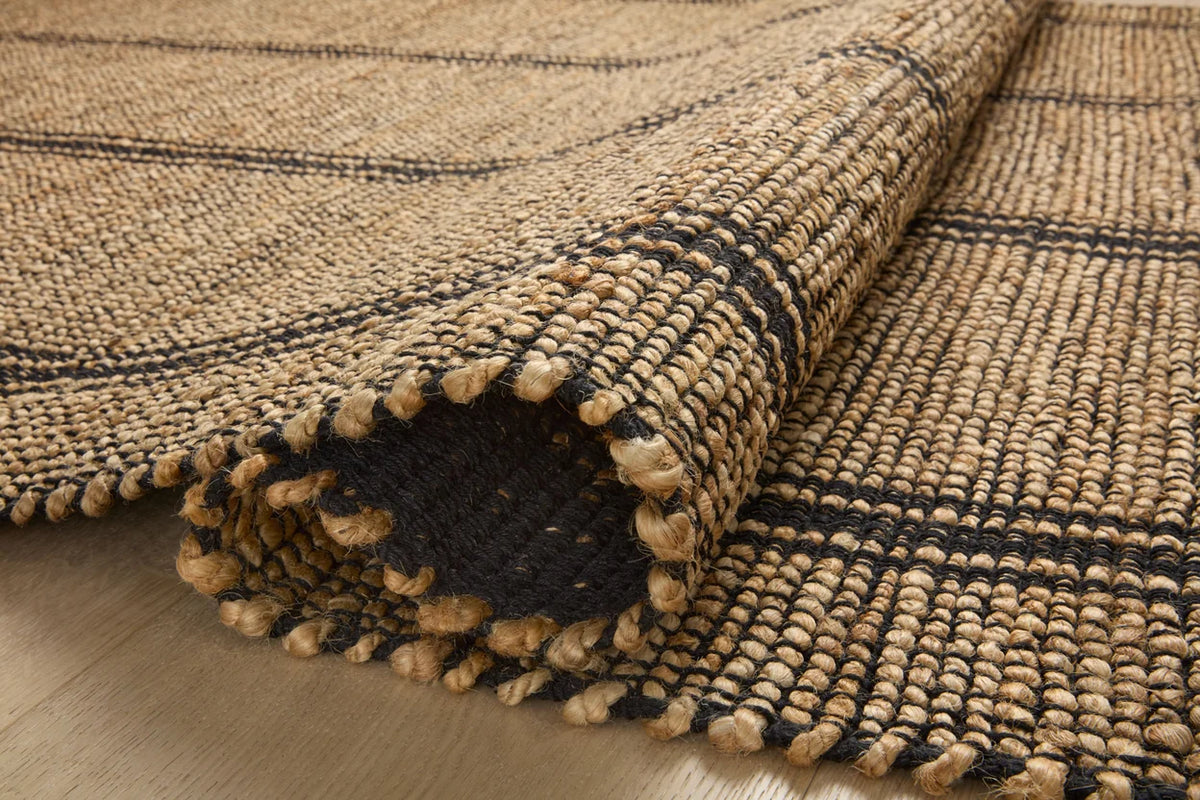 Close-up of the Colton rug showcasing the woven jute and cotton texture, natural fibers, and artisan craftsmanship.