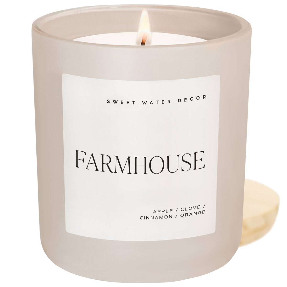 Front view of the Farmhouse scented candle, featuring a soy-based wax blend and comforting spiced apple fragrance.