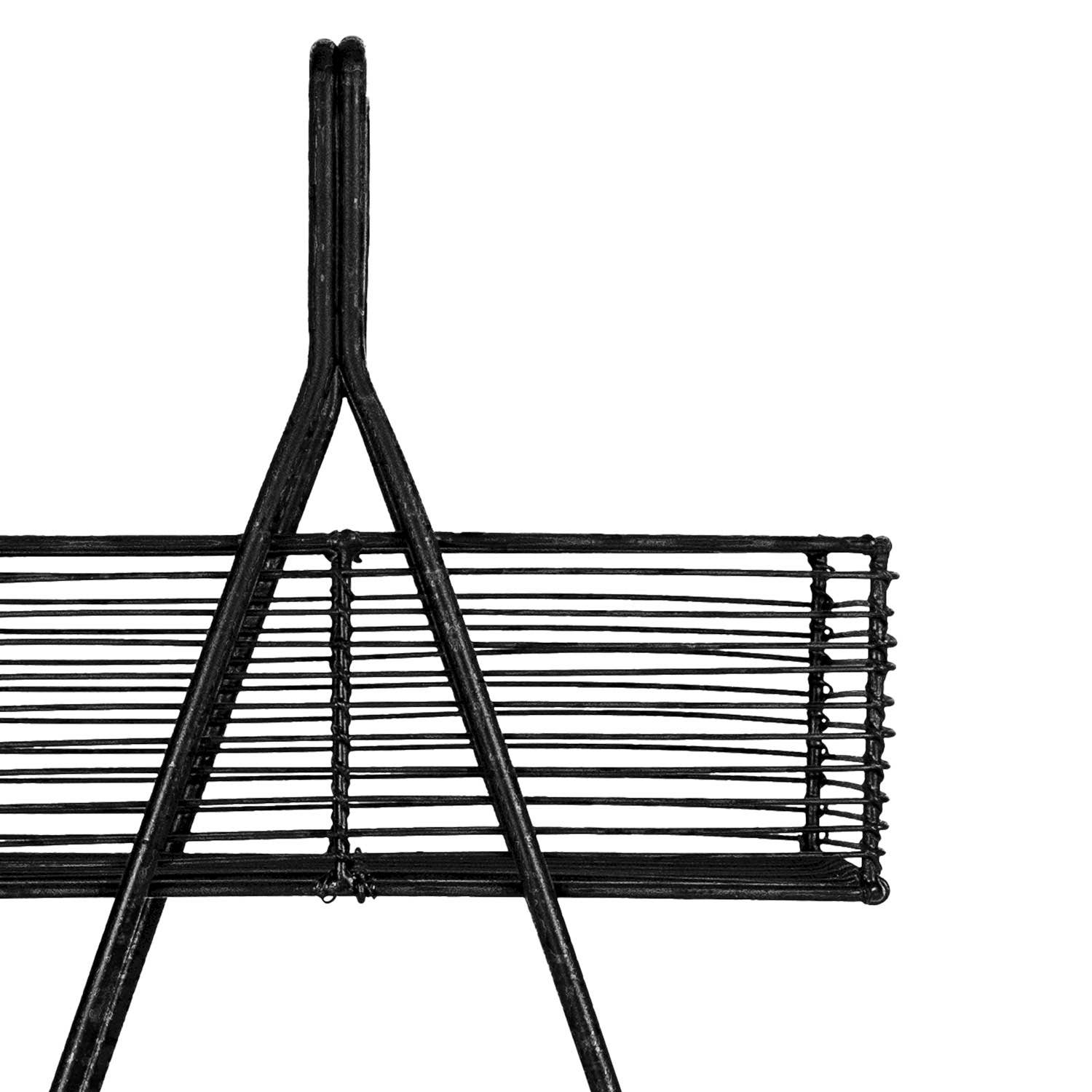 Close-up of the Atticus Two-Tier Wire Basket highlighting the hand-forged black metal wire construction and open storage design.