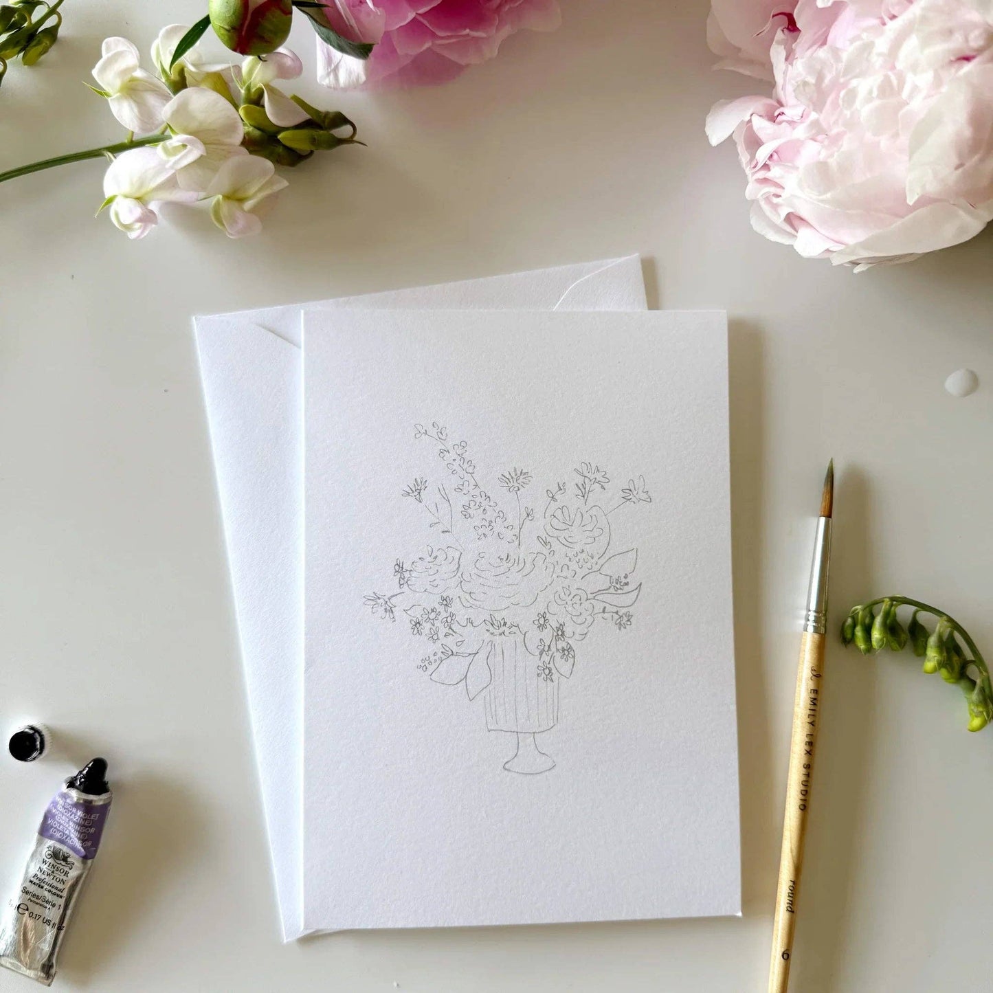 Paintable watercolor notecards with lightly sketched floral bouquet illustrations.