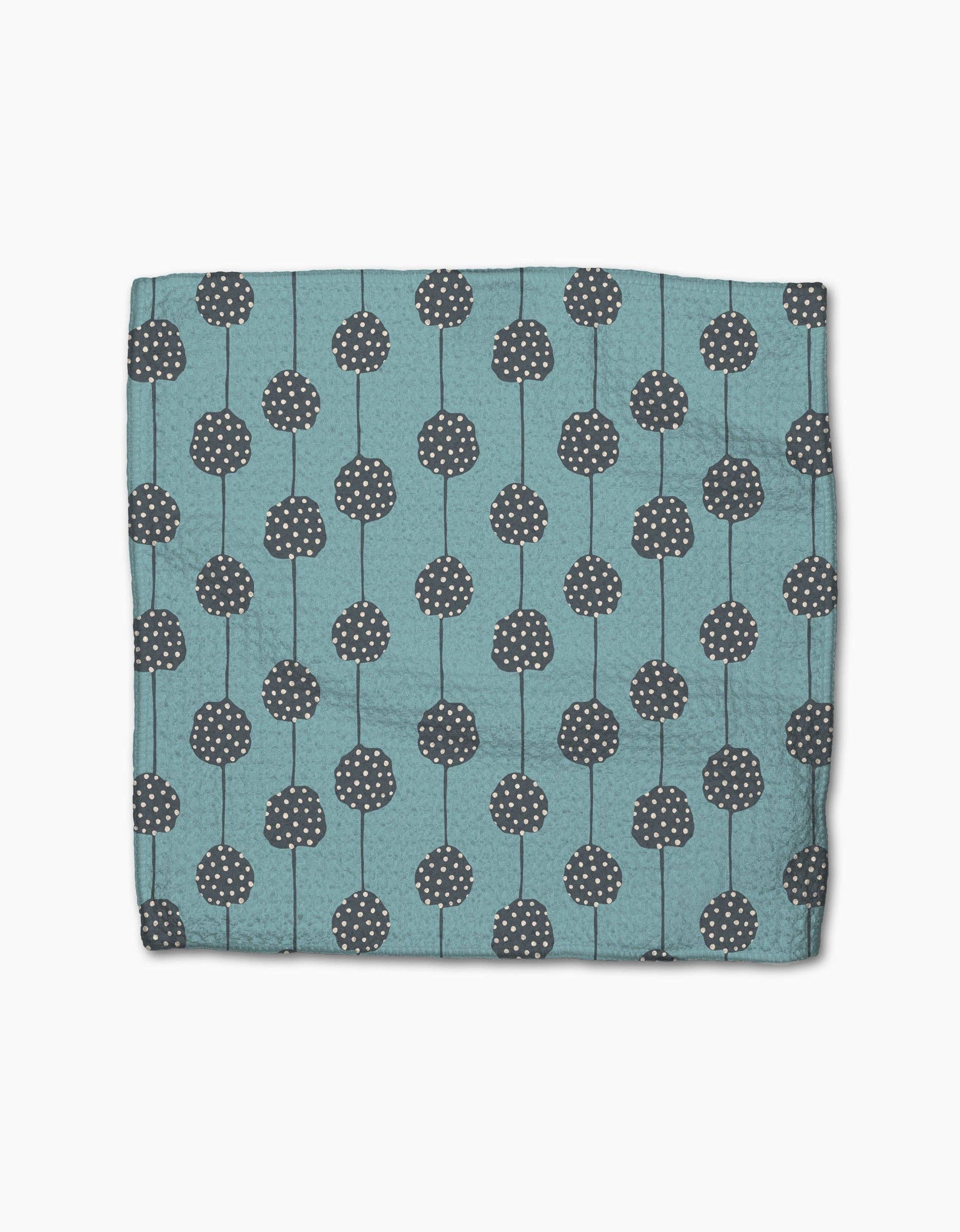 Close-up of the Polka Dot Blooms dishcloths showing Geometry's absorbent, quick-drying Geoweave fabric.
