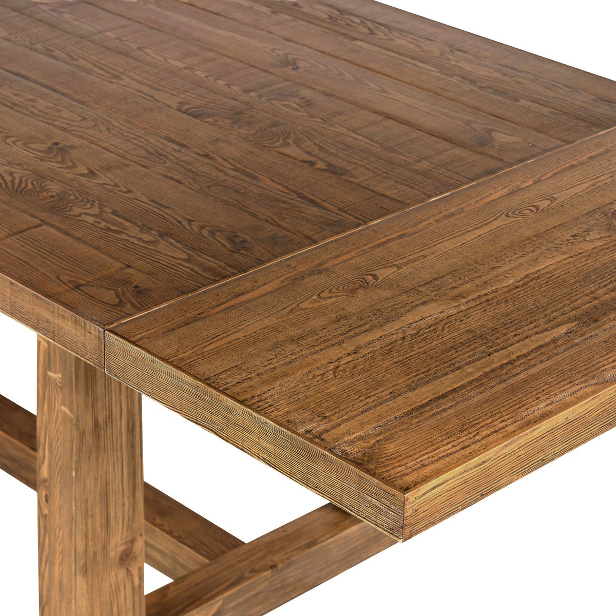 Close-up of the waxed pine tabletop showing its warm honey finish and natural wood character.