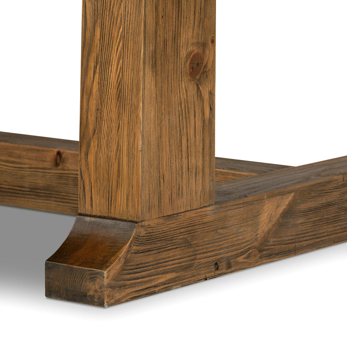 Close-up of the solid pine trestle base on the Foundry Pine Extension Dining Table.