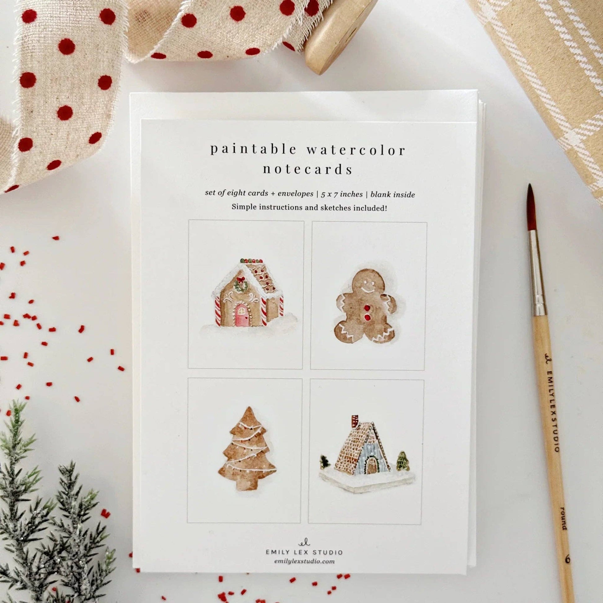 Gingerbread Paintable Watercolor Notecard Set by Emily Lex featuring eight paint-your-own holiday cards with gingerbread house, gingerbread man, Christmas tree, and chalet illustrations.