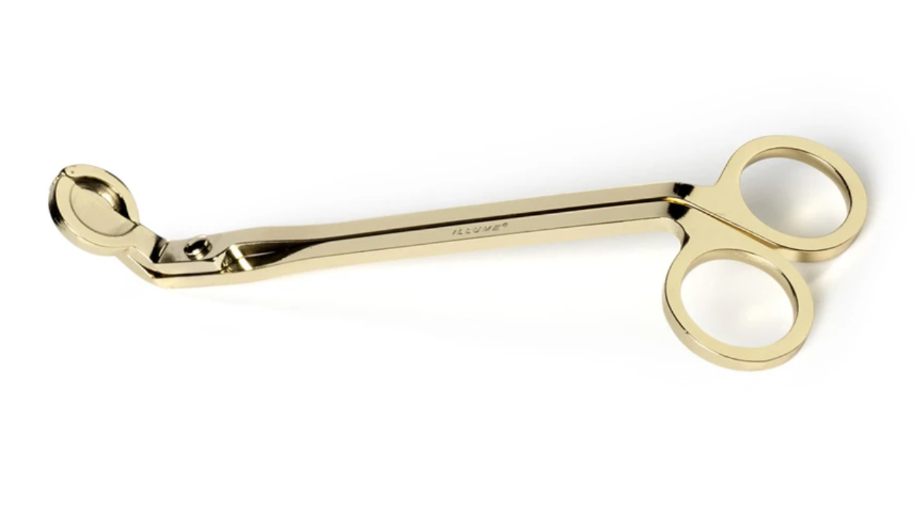 Gold candle wick trimmer designed to promote cleaner burns and extend candle life.