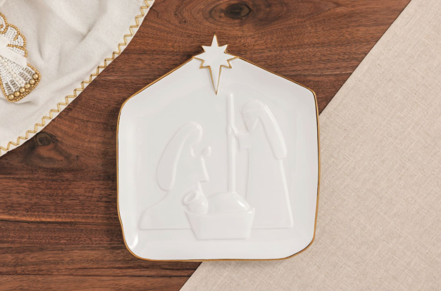 Stoneware serving platter featuring a raised Nativity scene with a hand-painted gold rim.