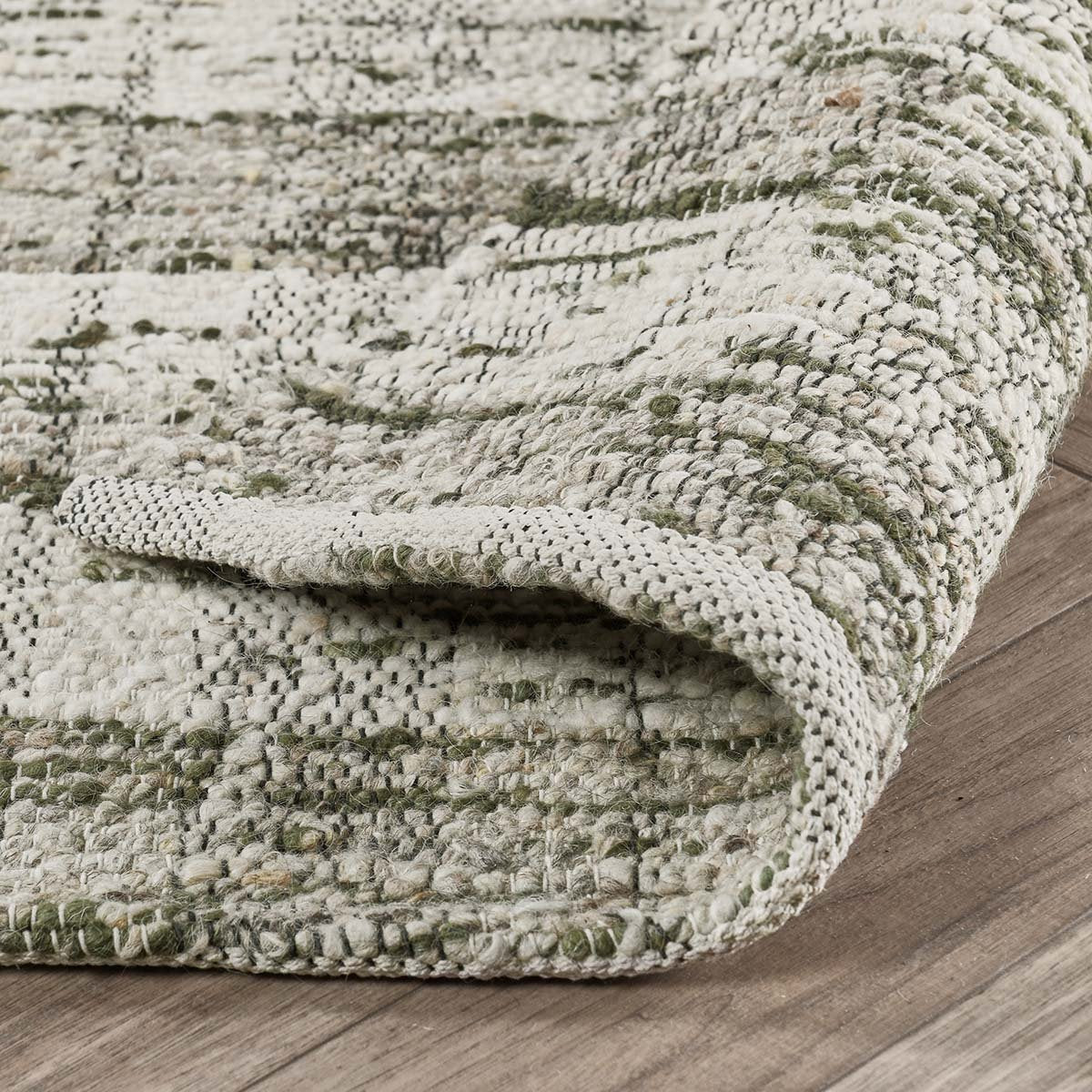 Close-up of the Perth rug showcasing the lofty hand-carded wool, woven striped pattern, and artisan craftsmanship.