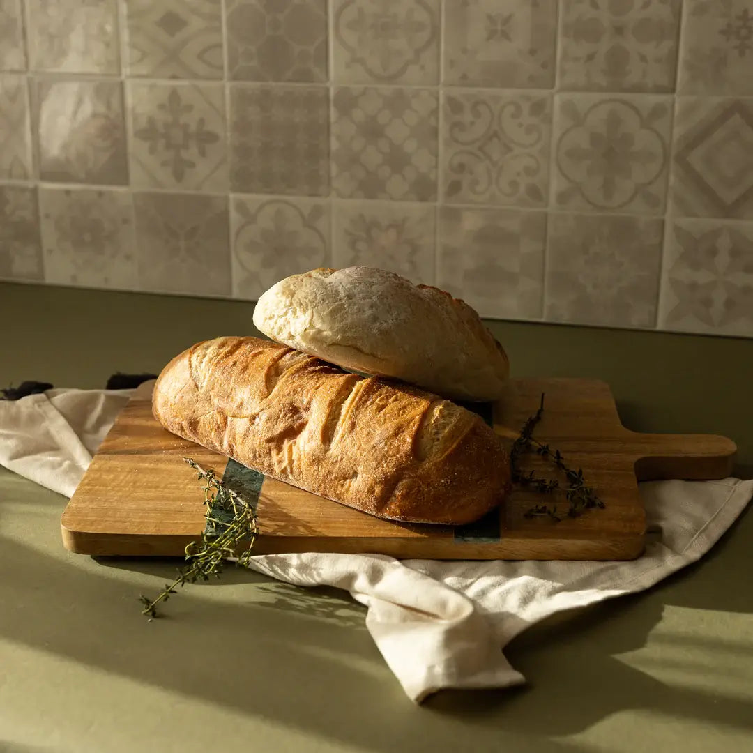 Cillian serving board crafted from sustainable mango wood with a genuine Spider Green marble inlay.