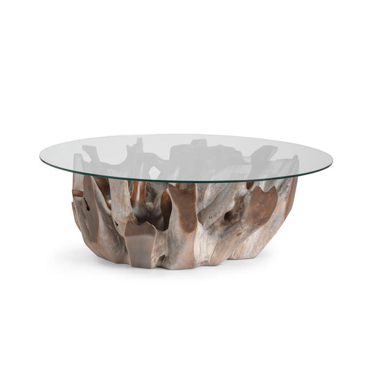 Hailey round coffee table featuring a sculptural reclaimed teak root base with a clear tempered glass top.
