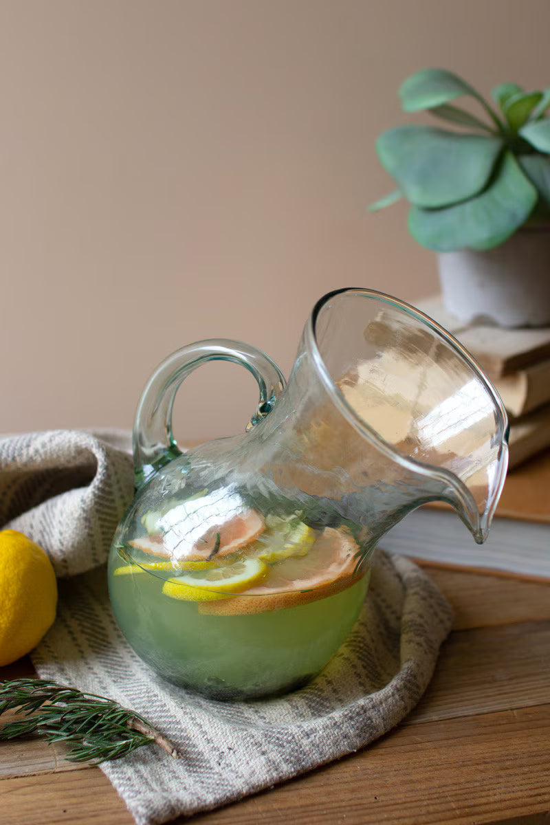 Handblown glass tilted pitcher handcrafted in Colombia.