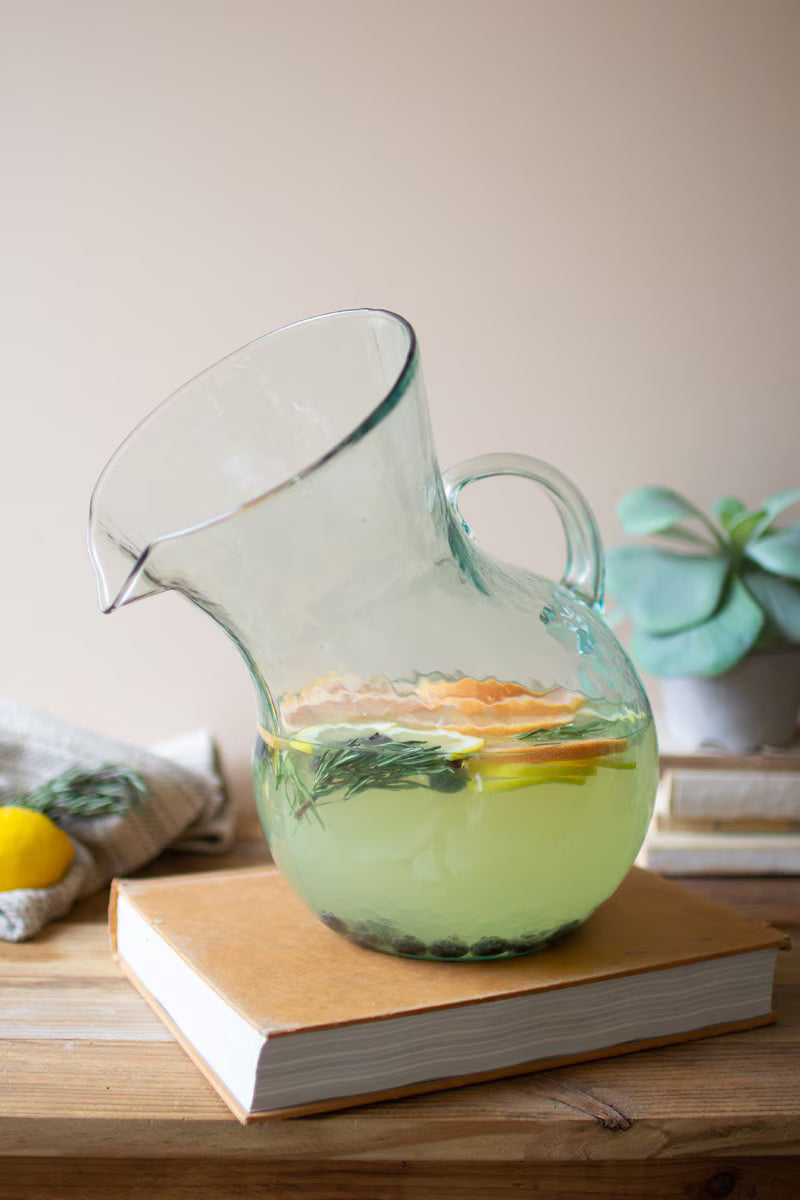 Large handblown glass tilted pitcher handcrafted by artisans in Colombia.