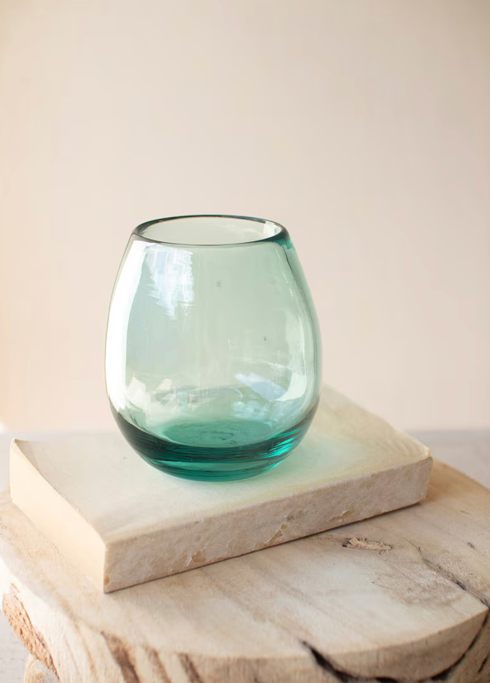 Handblown stemless wine glass crafted from recycled glass with an organic shape.