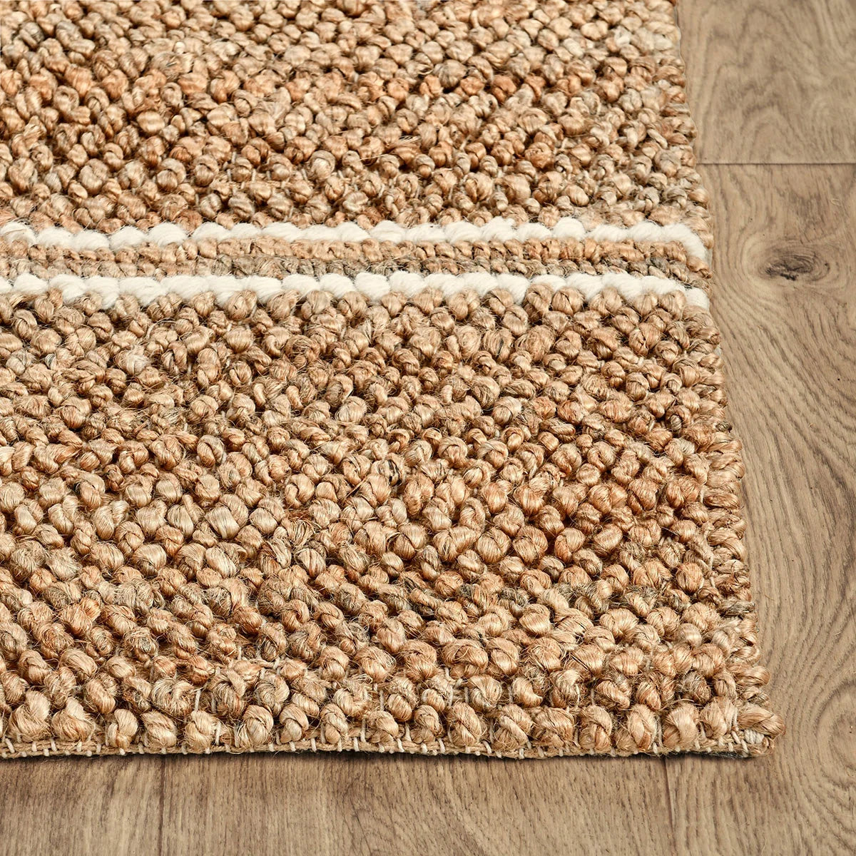 Close-up of the Madrid rug highlighting the natural woven texture and durable blend of jute, cotton, and wool fibers.