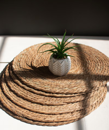 Handwoven seagrass placemats made from natural fibers.