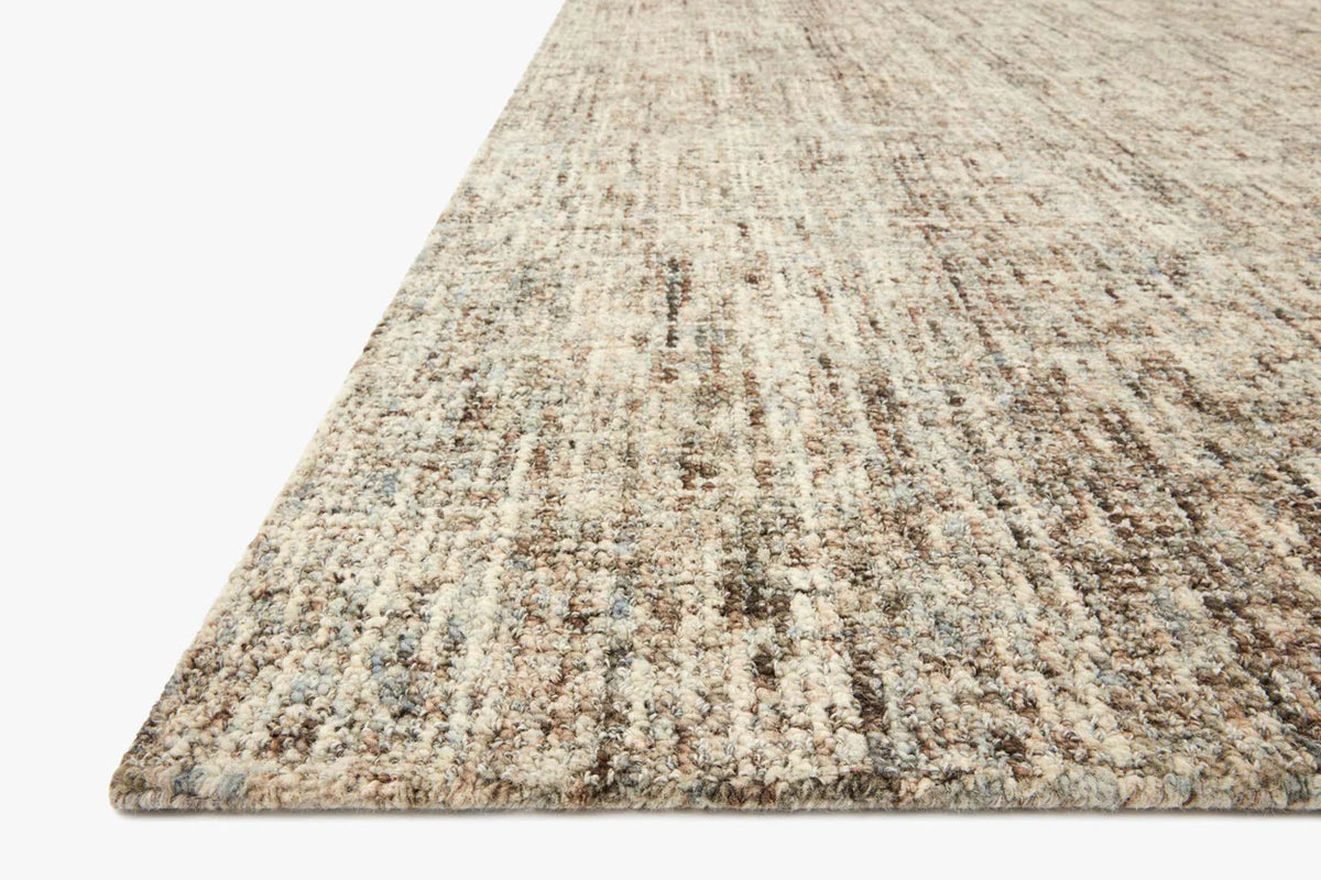 Close-up of the Harlow wool rug highlighting the hand-tufted texture, natural wool fibers, and subtle mocha and mist color variation.