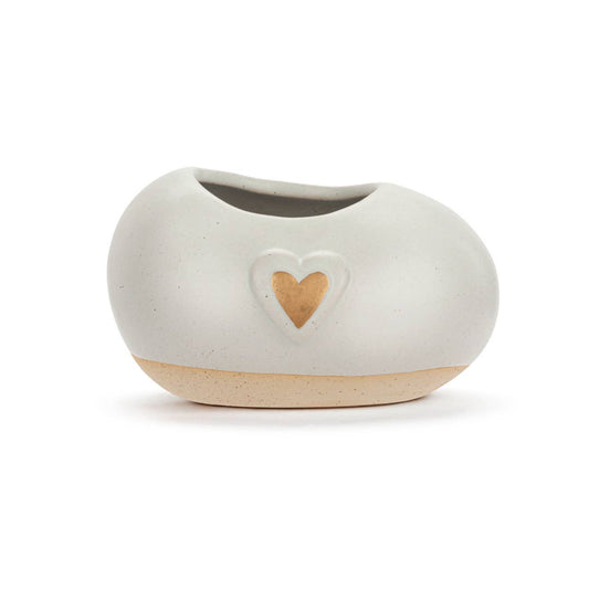 Small stoneware planter featuring a subtle heart design.