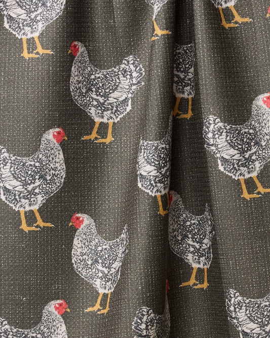 Fabric with chicken pattern on a dark background