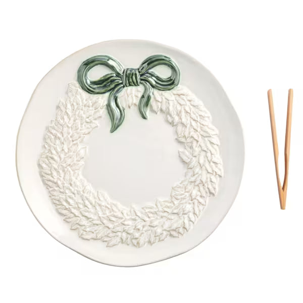 Ceramic stoneware serving plate featuring a raised wreath design and reactive glaze finish.