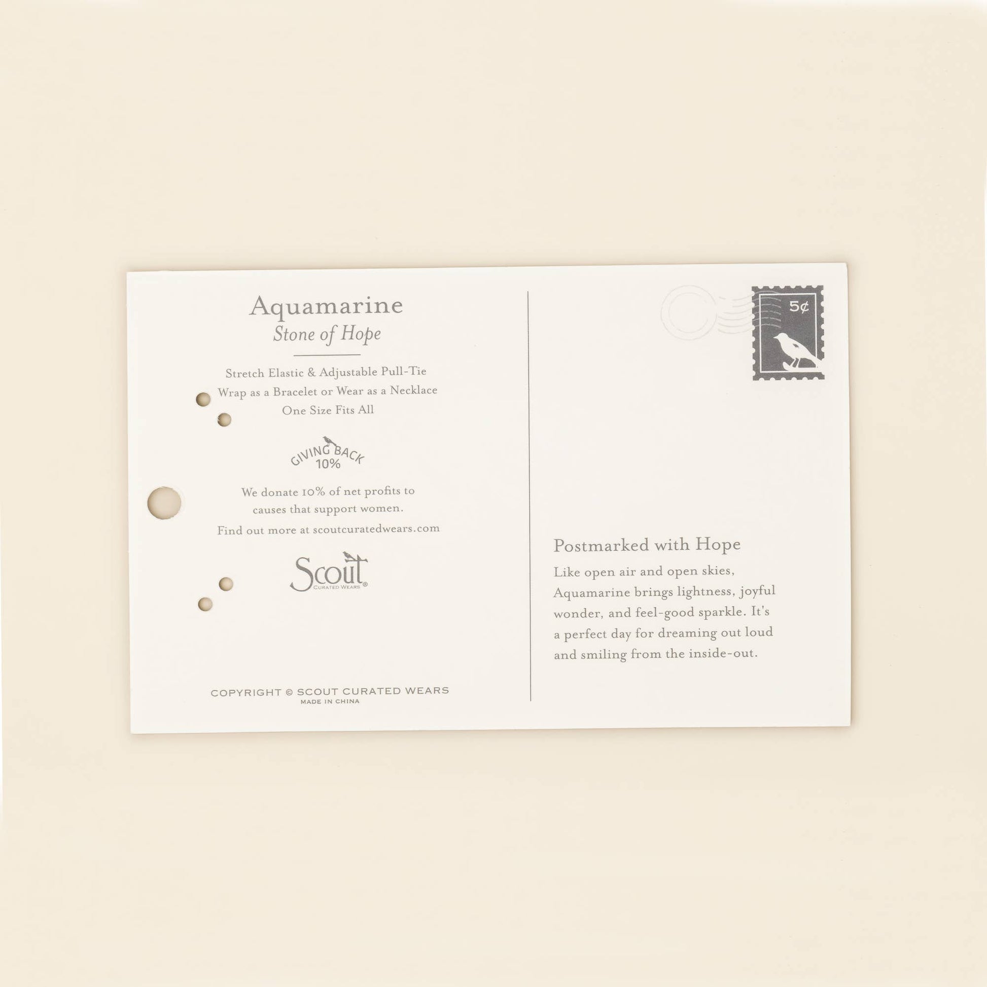 Product packaging for Aquamarine stone with brand name 'Scout' on a beige background