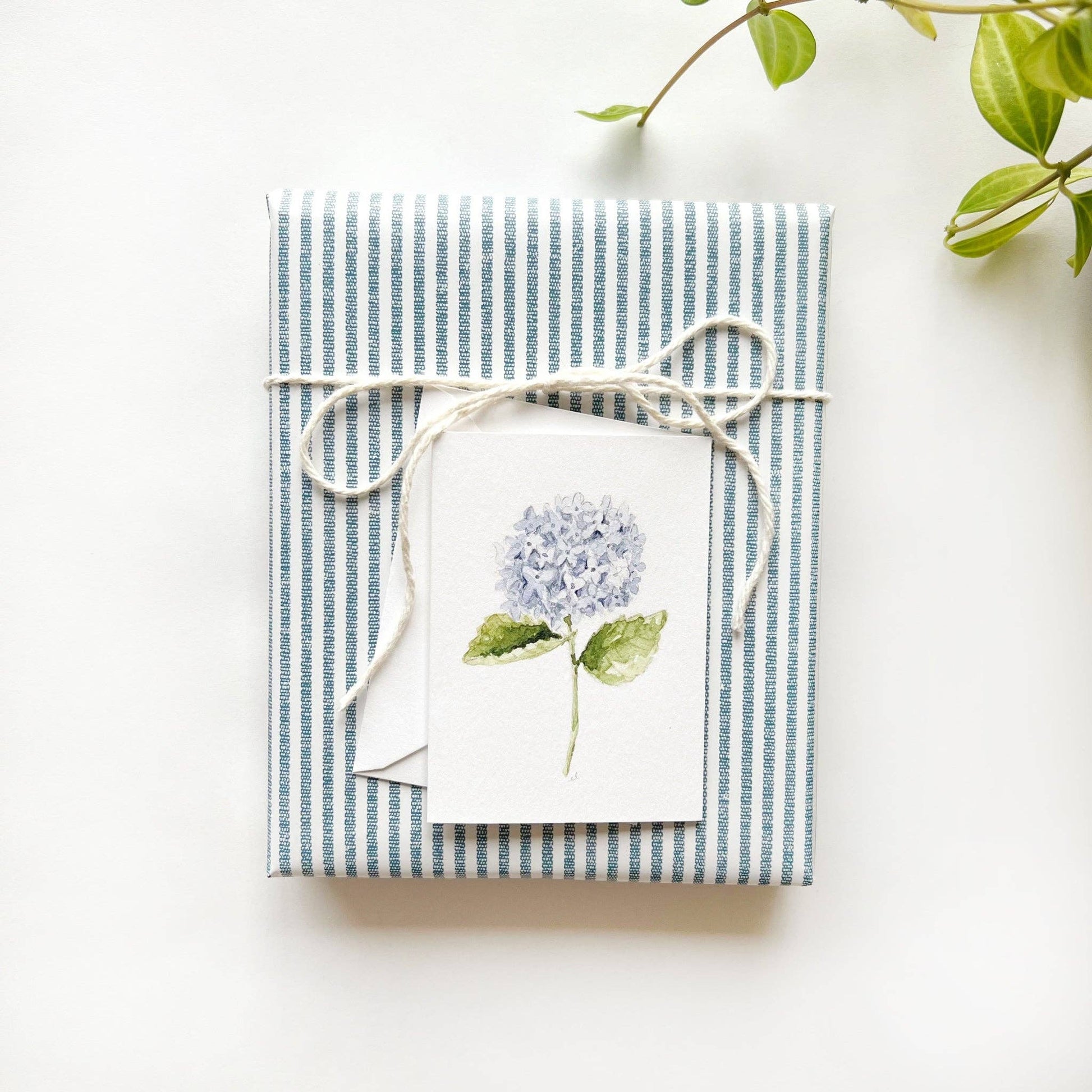 Close-up of the Hydrangea Stem Mini Notecard printed on premium 120 lb superfine paper with a blank interior for handwritten messages.