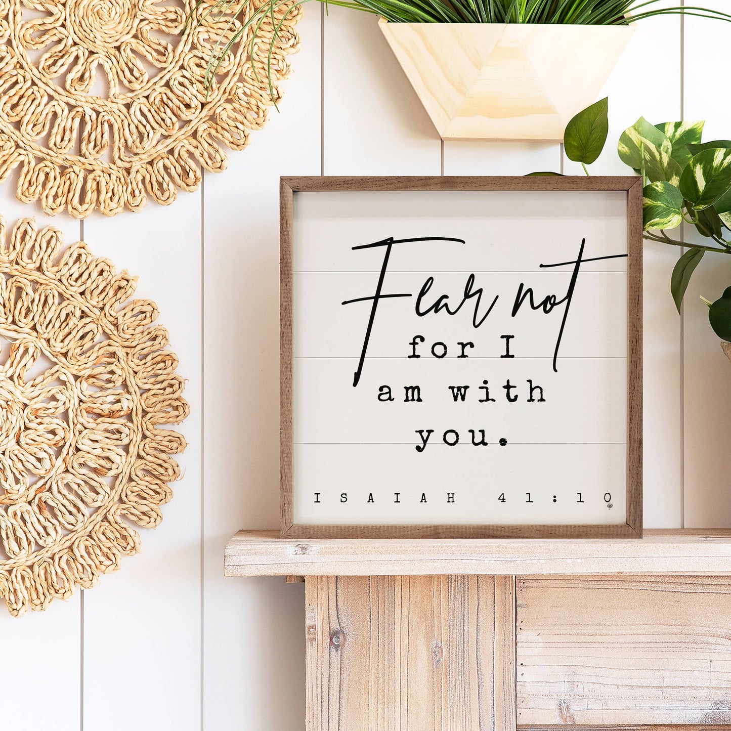 Isaiah 41:10 framed wood sign layered on a mantel with natural wood and greenery.