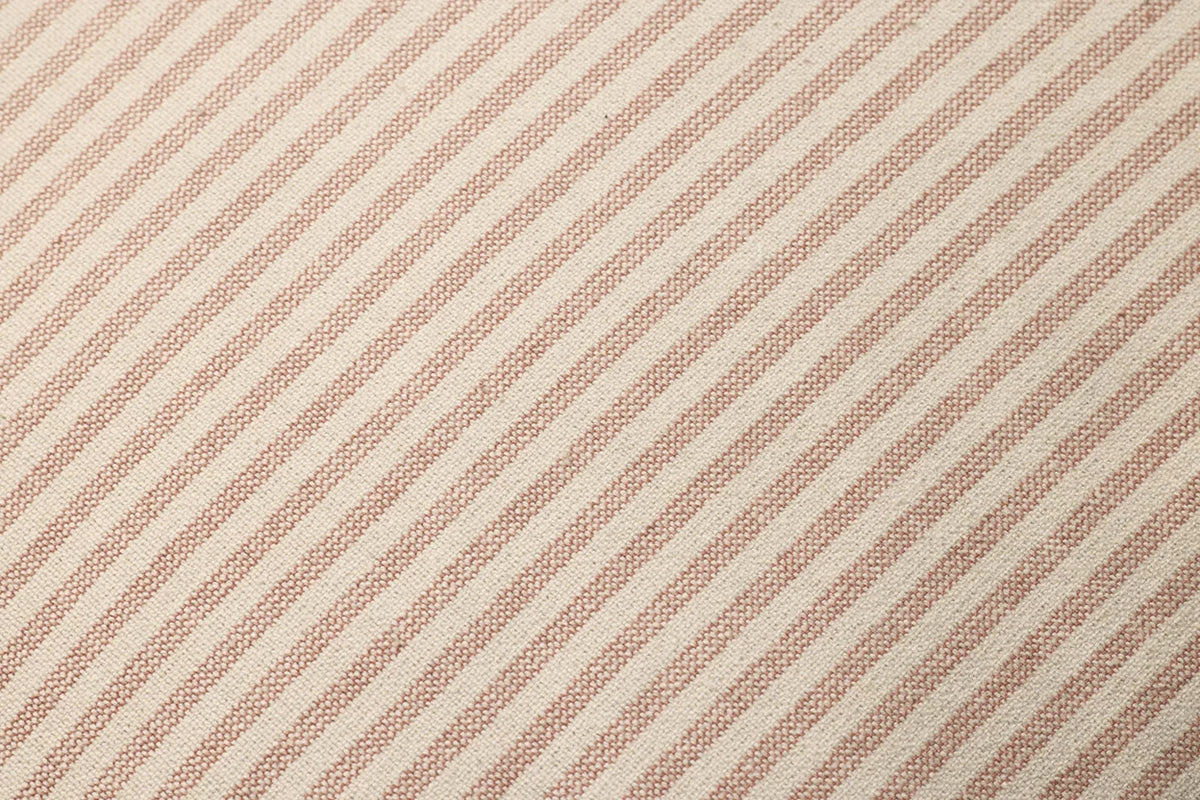 Close-up of the Sullivan pillow highlighting the woven cotton texture, flange edge, hidden zipper with antique bronze Loloi logo pull, and warm terracotta tones.