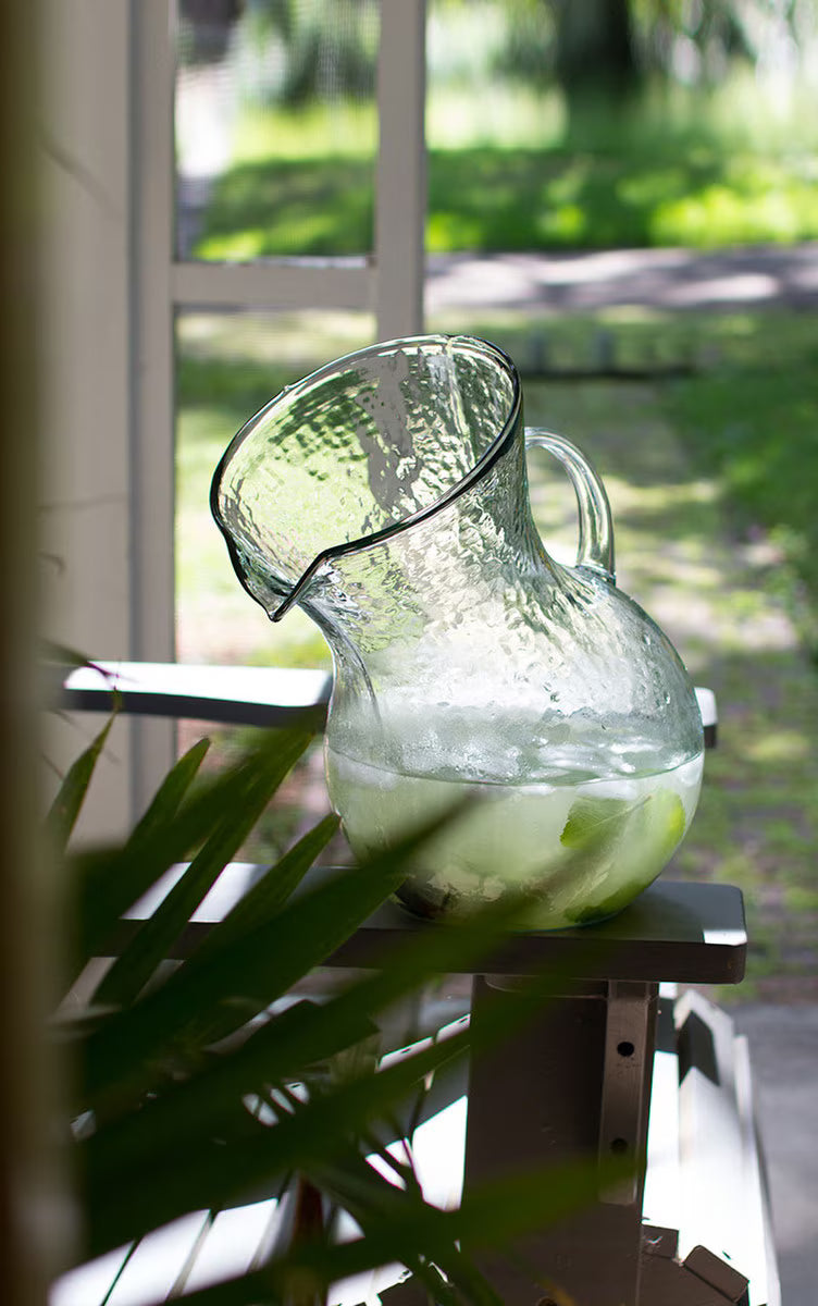 Large handblown glass tilted pitcher handcrafted by artisans in Colombia.