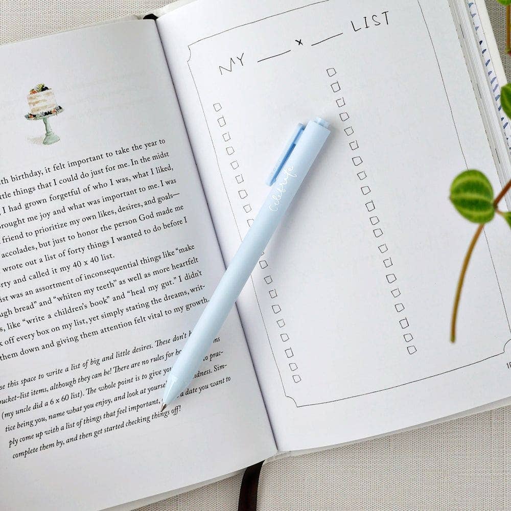 Matte finish gel ink pen featuring the word “celebrate” in handwritten script.