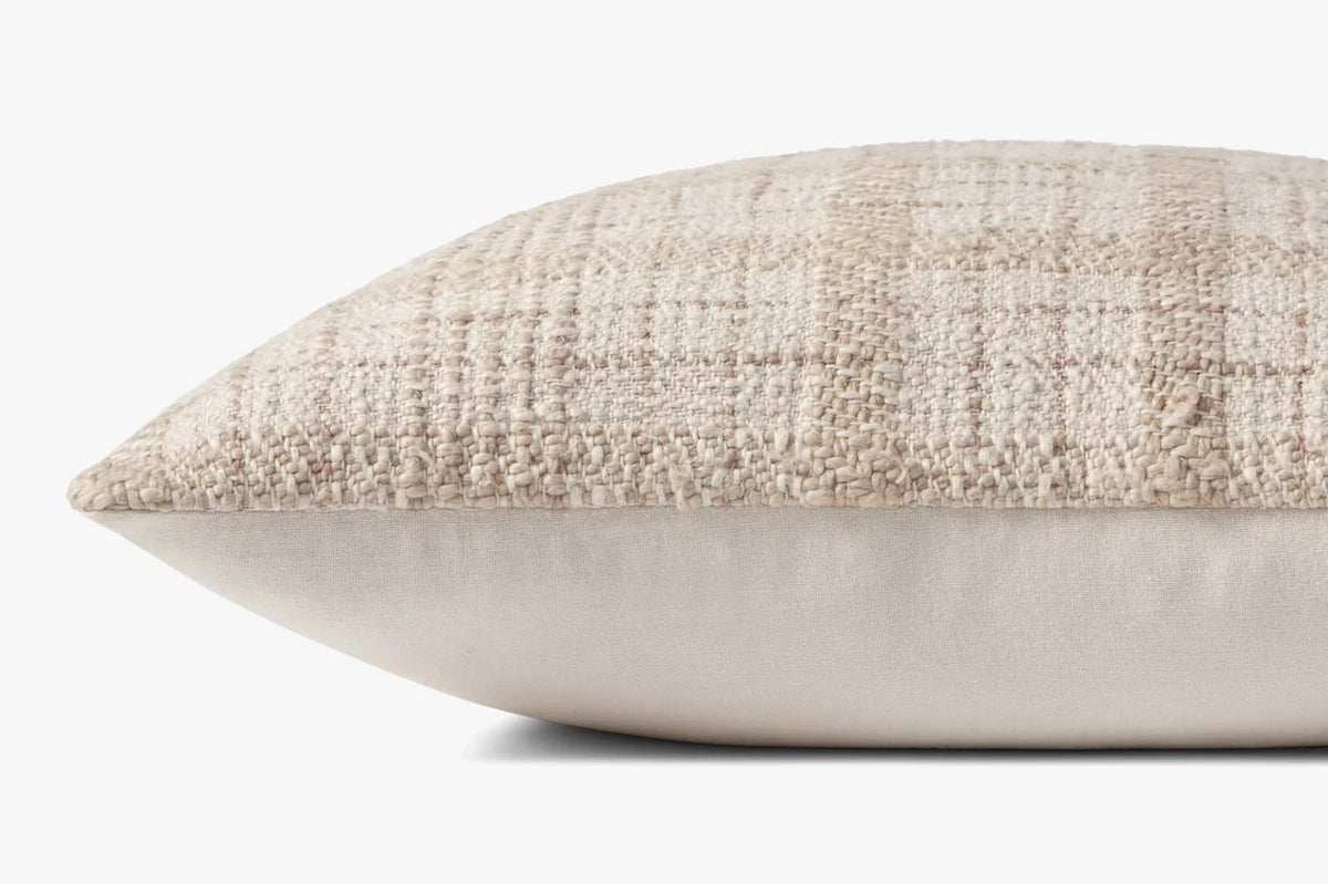 Close-up of the Fern pillow highlighting the woven check texture, knife-edge finish, and hidden zipper with antique bronze Loloi logo pull.