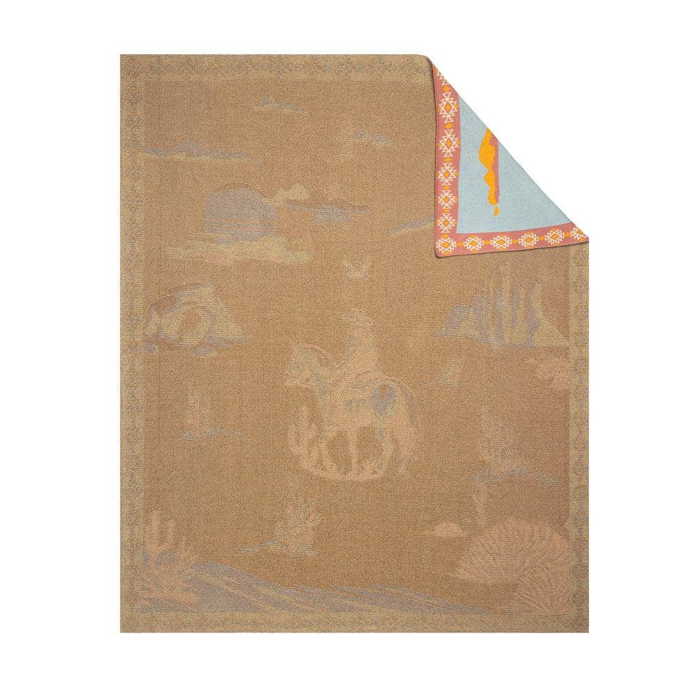 Lone Bronco Rider Woven Throw Blanket featuring a cowboy riding a bucking bronco beneath a dusty blue prairie sky with a tribal-inspired border.