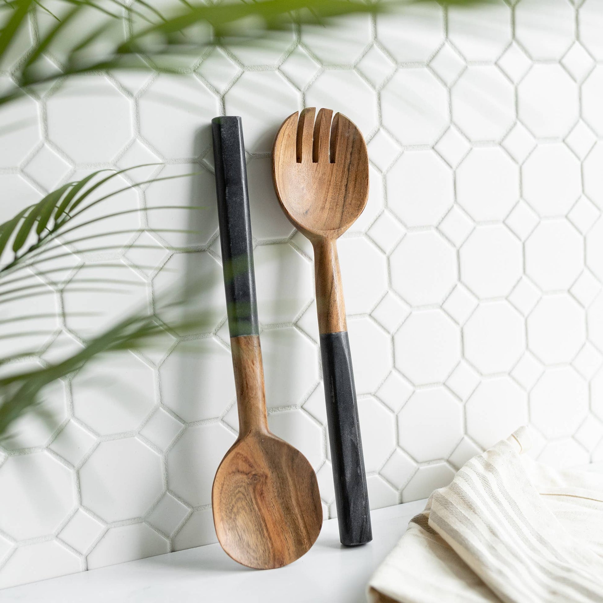 Louisa serving utensil set crafted from sustainable acacia wood with genuine black marble handles.
