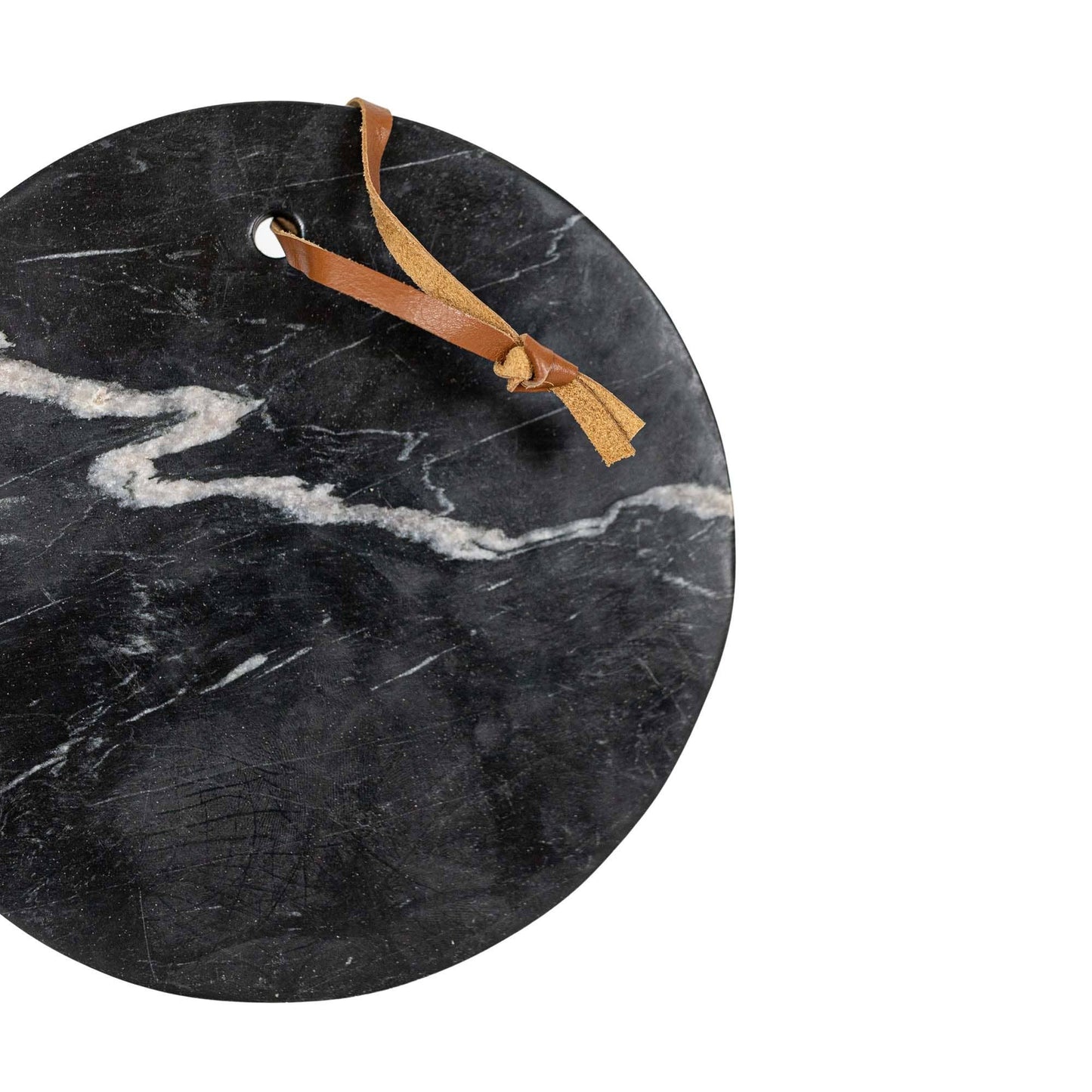 Round black marble serving board with a genuine leather hanging loop.
