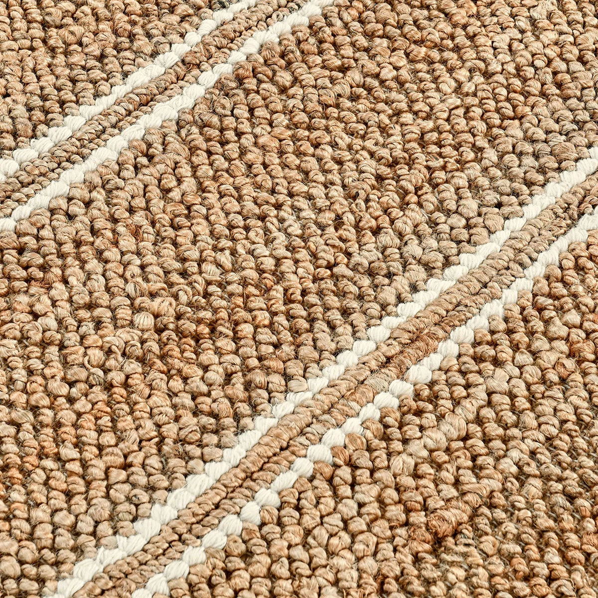 Close-up of the Madrid rug highlighting the natural woven texture and durable blend of jute, cotton, and wool fibers.