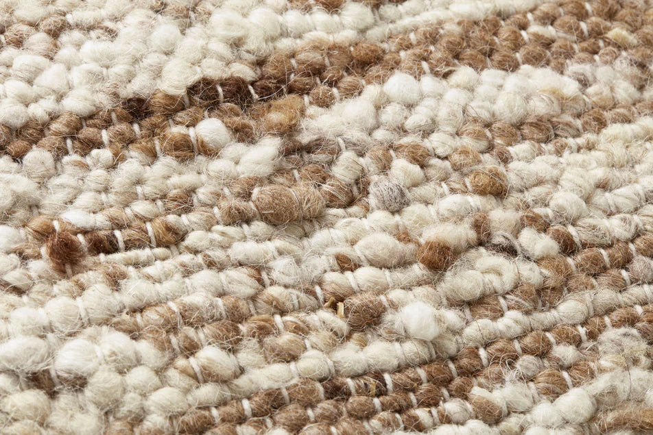 Close-up of the handwoven wool, polyester, and cotton blend with rich texture on the Amber Lewis Marie pillow.