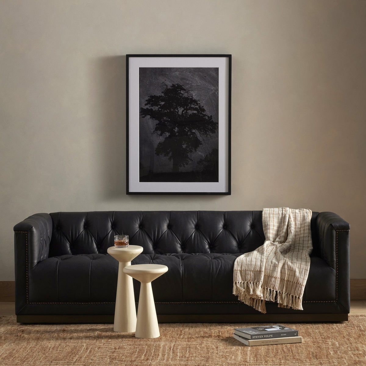 Maxx Heirloom Black Leather Sofa styled in a warm, collected living space.