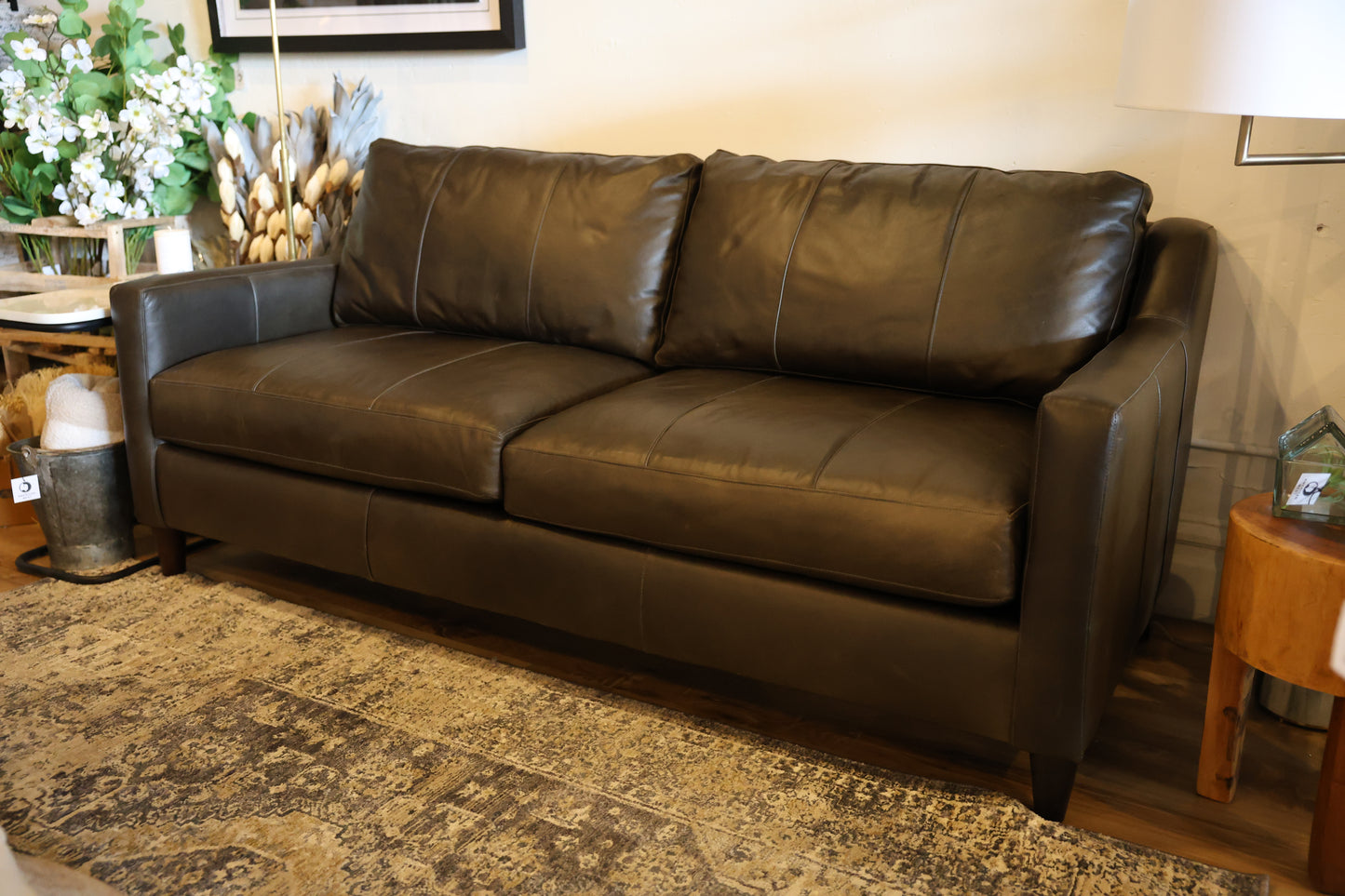 Close-up of the Melville sofa showcasing the natural character and texture of premium aniline leather.