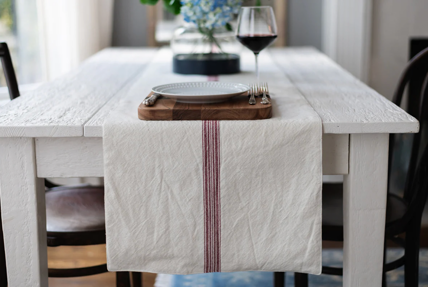 Vintage merlot stripe table runner crafted from soft cotton styled on a gathered old-world inspired dining table