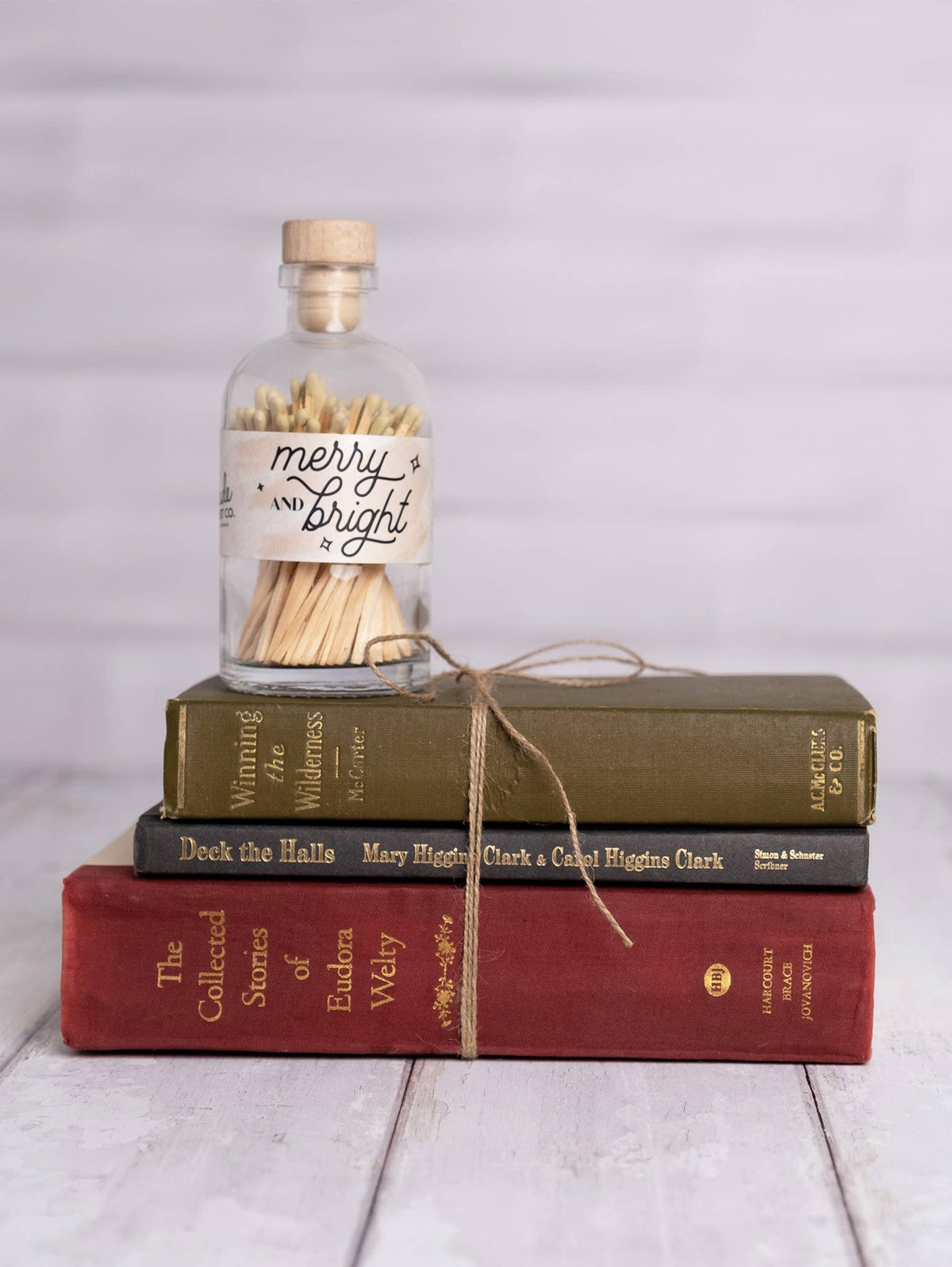 Merry & Bright vintage apothecary matches in a glass jar with festive gold match tips and wooden cork lid.