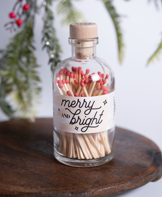 Merry & Bright vintage apothecary matches in a glass jar with festive red match tips and wooden cork lid.