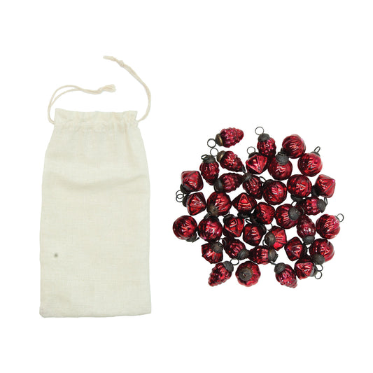 Set of 36 mini embossed red mercury glass ornaments with assorted vintage-inspired patterns and a muslin storage bag.