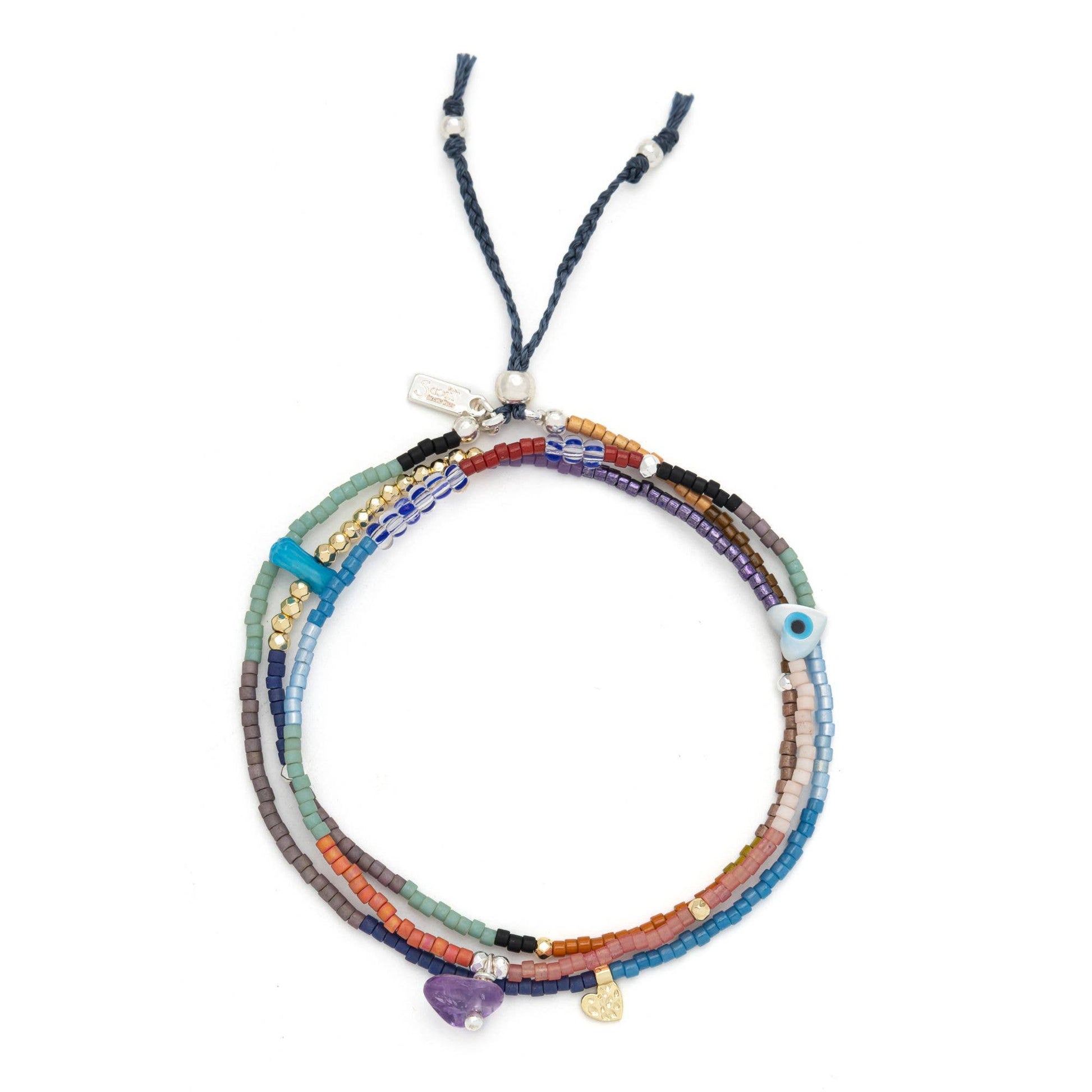 Close-up of handcrafted amethyst stones, freshwater pearls, Miyuki beads, and the adjustable pull-tie on the Mixed Media Wrap Bracelet & Necklace.