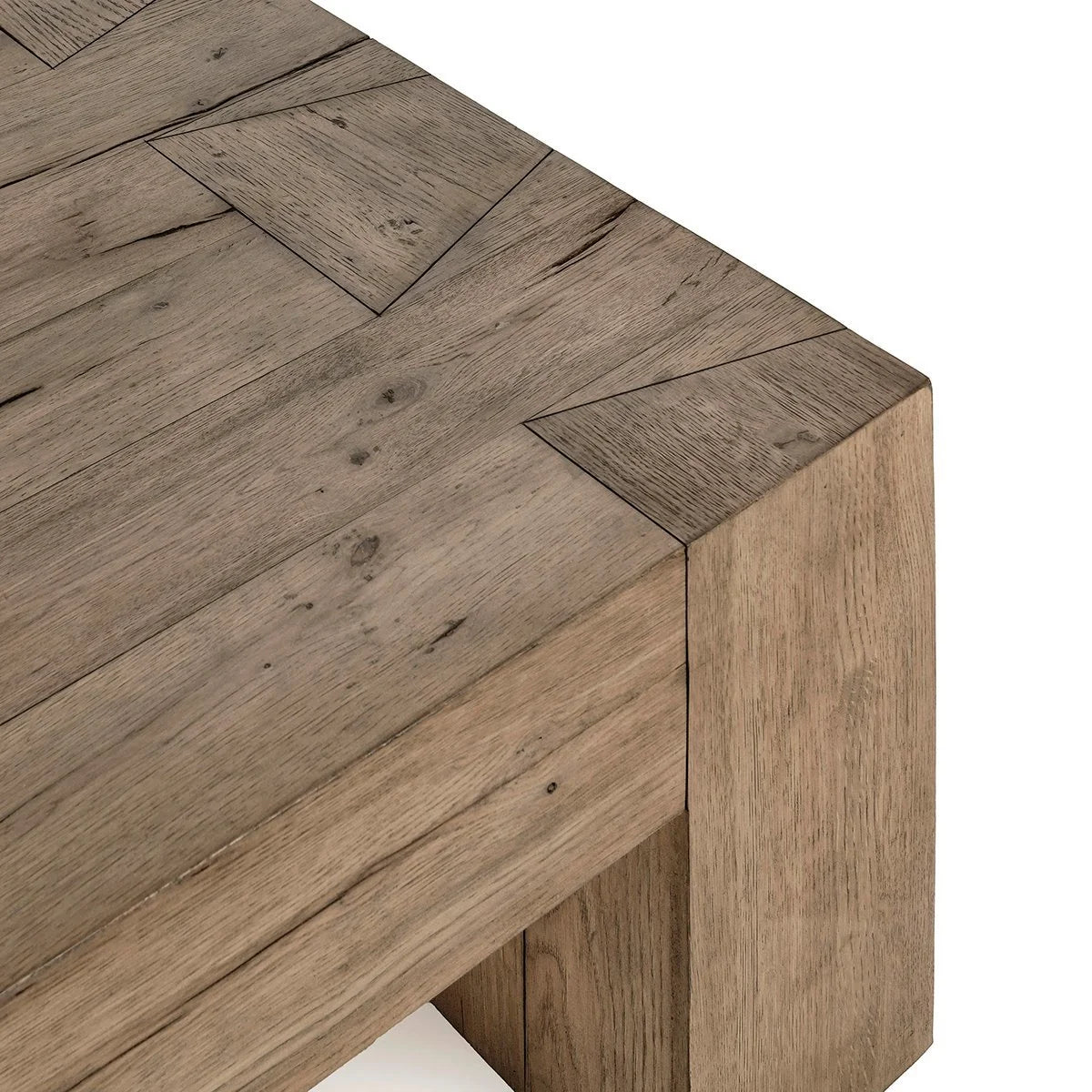 Close-up of the Bristol coffee table showcasing the reclaimed oak grain, natural cracks, exposed joinery, and warm Café Brown finish.