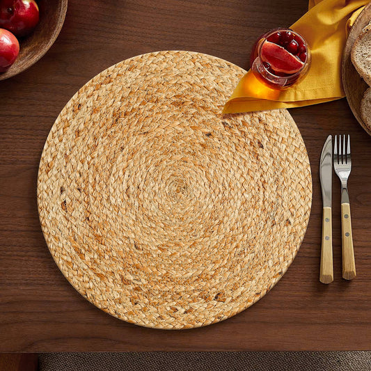 Natural woven jute round placemat measuring 14 inches in diameter.