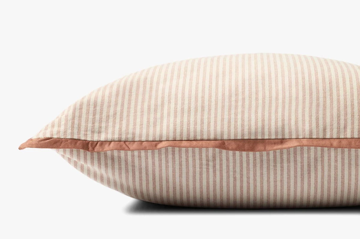 Close-up of the Sullivan pillow highlighting the woven cotton texture, flange edge, hidden zipper with antique bronze Loloi logo pull, and warm terracotta tones.